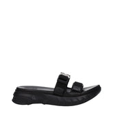 Givenchy black fabric slippers for men featuring a wide front strap with white embroidered logo and contoured footbed.
