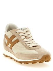 Perfil lateral de las zapatillas deportivas Hogan beige que muestran la tela de poliamida técnica y el diseño ergonómico de la entresuela deportiva.