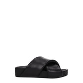 Jil Sander black leather slippers featuring a minimalist wide strap and contoured footbed for a refined silhouette.
