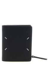 Maison Margiela black calfskin cardholder featuring the signature four white stitches on the front exterior.