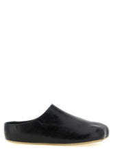 MM6 Maison Margiela black calfskin clogs featuring a minimalist slip-on silhouette and smooth leather finish.