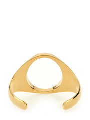 Side view of the MM6 Maison Margiela brass bracelet in polished gold, showcasing the sleek open-cuff design.