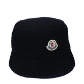 Front view of a Moncler blue wool bucket hat featuring the iconic felt logo patch on a structured crown.