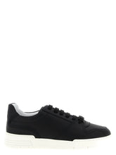 Moschino men's black leather low top sneakers featuring a minimalist profile and tonal stitching for a refined aesthetic.