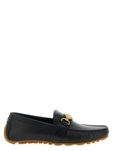 Front view of Moschino men's black leather slip-on loafers featuring a polished finish and classic almond toe silhouette.