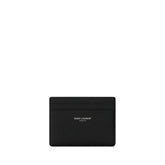 Saint Laurent black grained leather credit card holder with silver-tone logo foil stamp, front view.