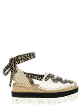 Stella McCartney beige cotton wedge sandals featuring a high platform and woven texture for a refined summer silhouette.