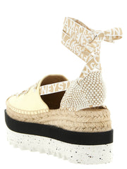 Rear view of the Stella McCartney bicolor sandals highlighting the clean lines and height of the modern wedge heel.