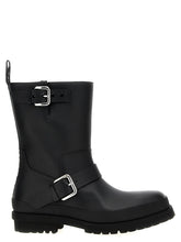 Front view of Stella McCartney black polyester ankle boots featuring a sleek pointed toe and structured silhouette.