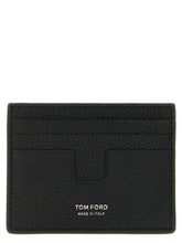 Front view of a Tom Ford black calfskin cardholder featuring gold-tone logo embossing and multiple card slots.