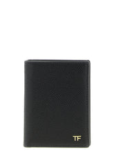 Front view of a Tom Ford black calfskin cardholder featuring gold-tone logo embossing and multiple card slots.