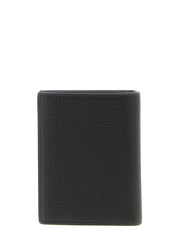 Perfil lateral del tarjetero de piel Tom Ford en negro, destacando el diseño fino y los bordes pintados a mano.
