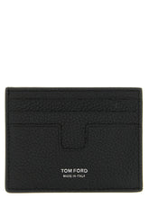 Front view of a Tom Ford black calfskin cardholder featuring gold-tone logo embossing and multiple card slots.