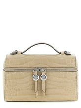 Front view of a Tory Burch beige cowhide shoulder bag featuring a structured silhouette and gold-tone hardware.