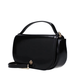 Side profile of the Tory Burch black leather bag highlighting its slim gusset design and refined edge stitching.