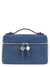 Front view of a Tory Burch blue lamb leather handbag featuring a structured silhouette and signature gold-tone hardware.