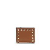 Valentino Garavani brown lambskin Ovis Aries wallet featuring a gold-tone VLogo Signature emblem on the front flap.