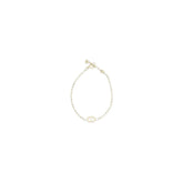 Valentino Garavani gold-tone metal cuff bracelet featuring the iconic VLogo Signature emblem in a polished finish.
