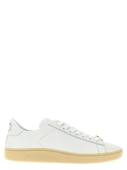 Valentino Garavani white calfskin low top sneakers featuring a minimalist profile and tonal lace-up closure.