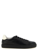 Versace bicolor calfskin low top sneakers in a refined black and white palette, front view for the AmeOro collection.