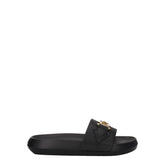 Versace black leather slippers featuring a wide front strap and minimalist silhouette for a refined summer aesthetic.