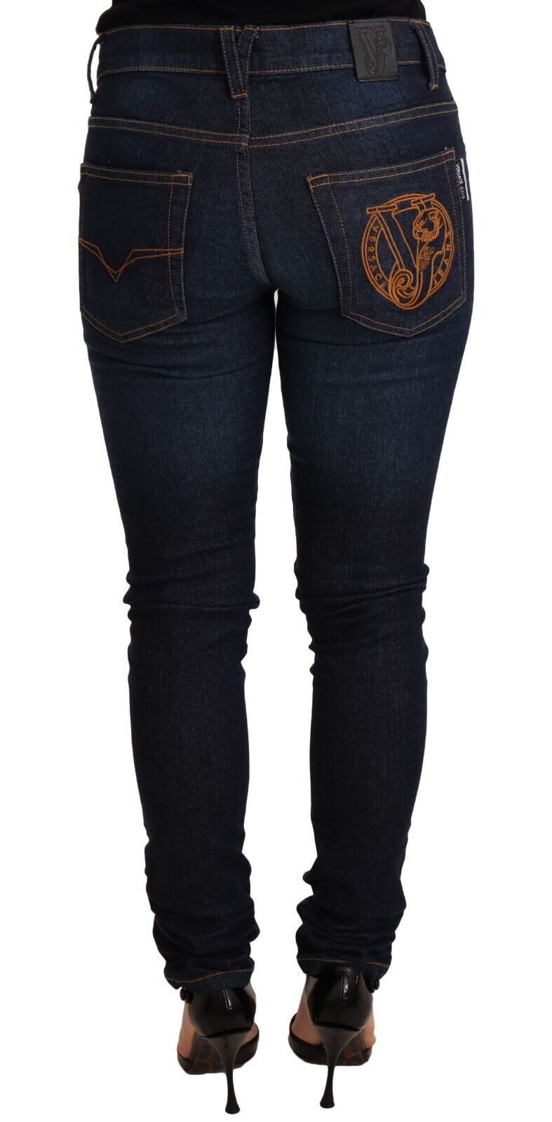 Jean Versace en denim bleu foncé, taille basse, en coton skinny.