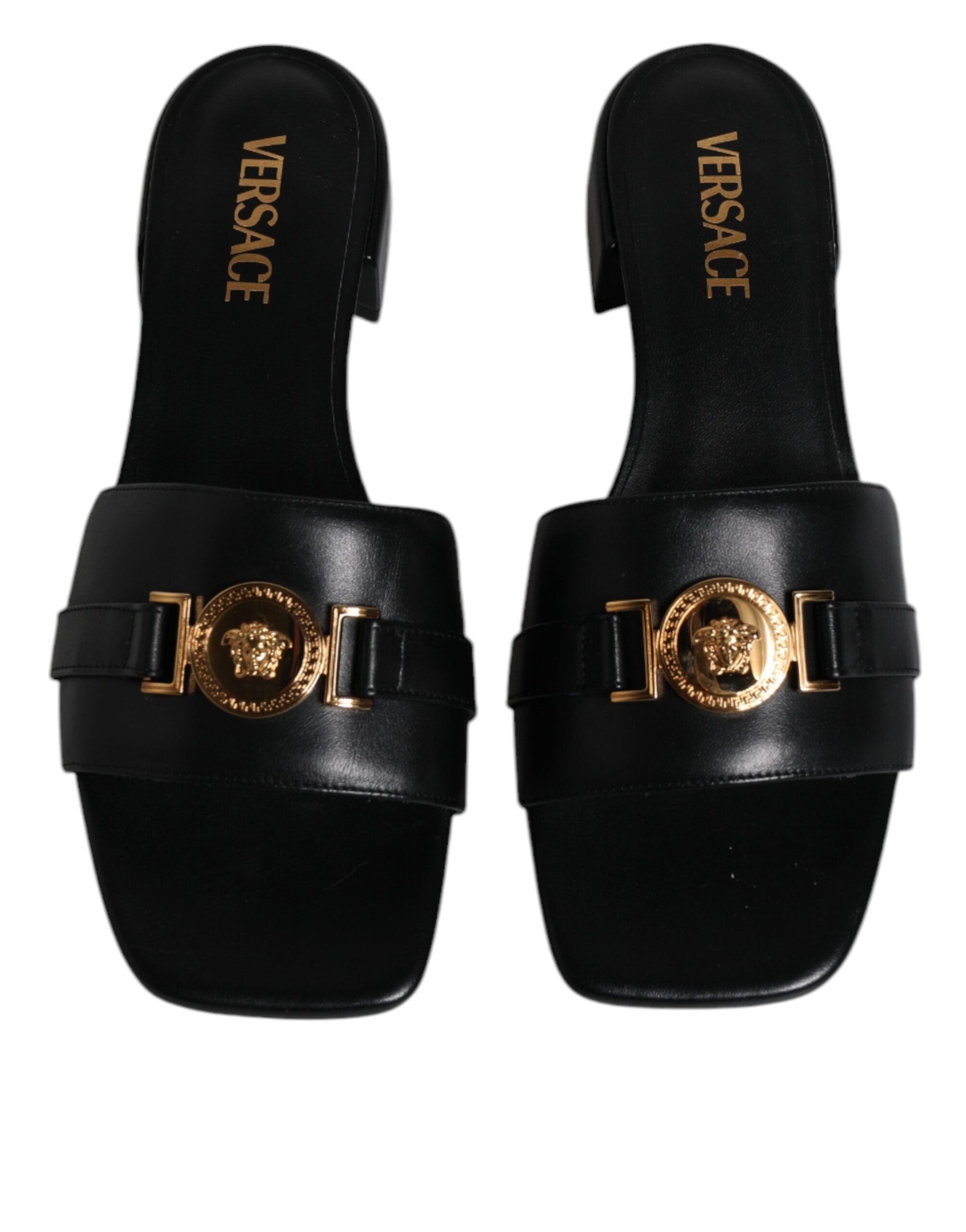 Sandales plates Versace en cuir noir avec plaque logo