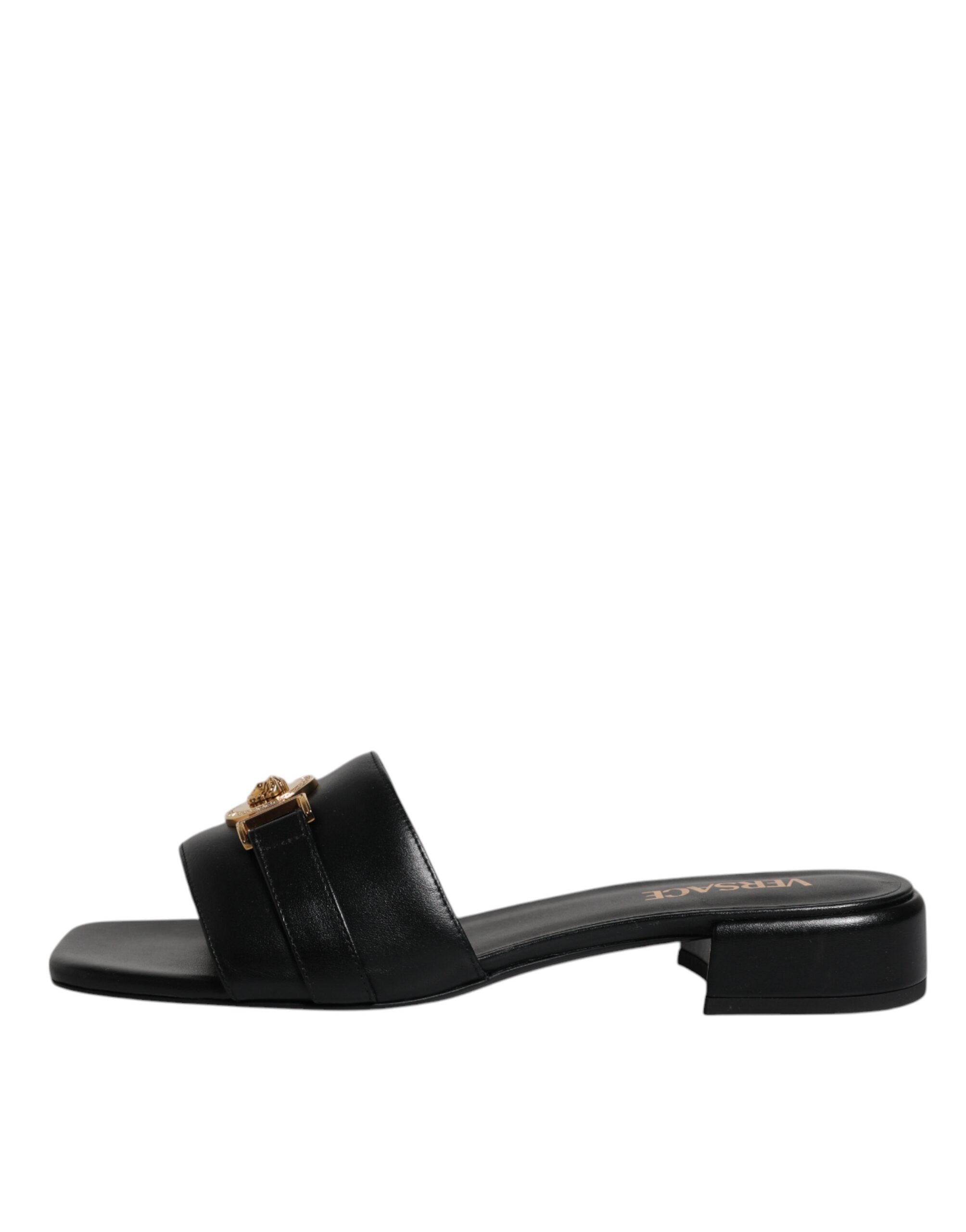 Sandales plates Versace en cuir noir avec plaque logo