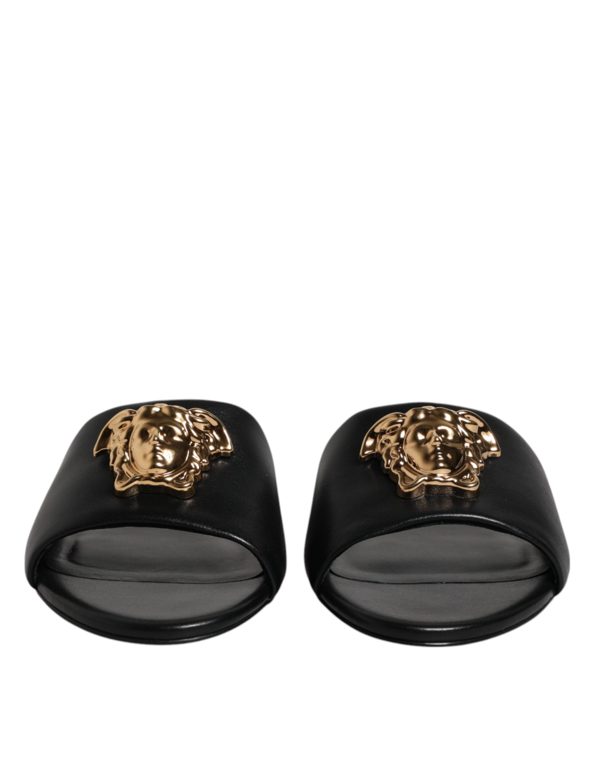 Sandales plates Versace en cuir noir avec plaque logo