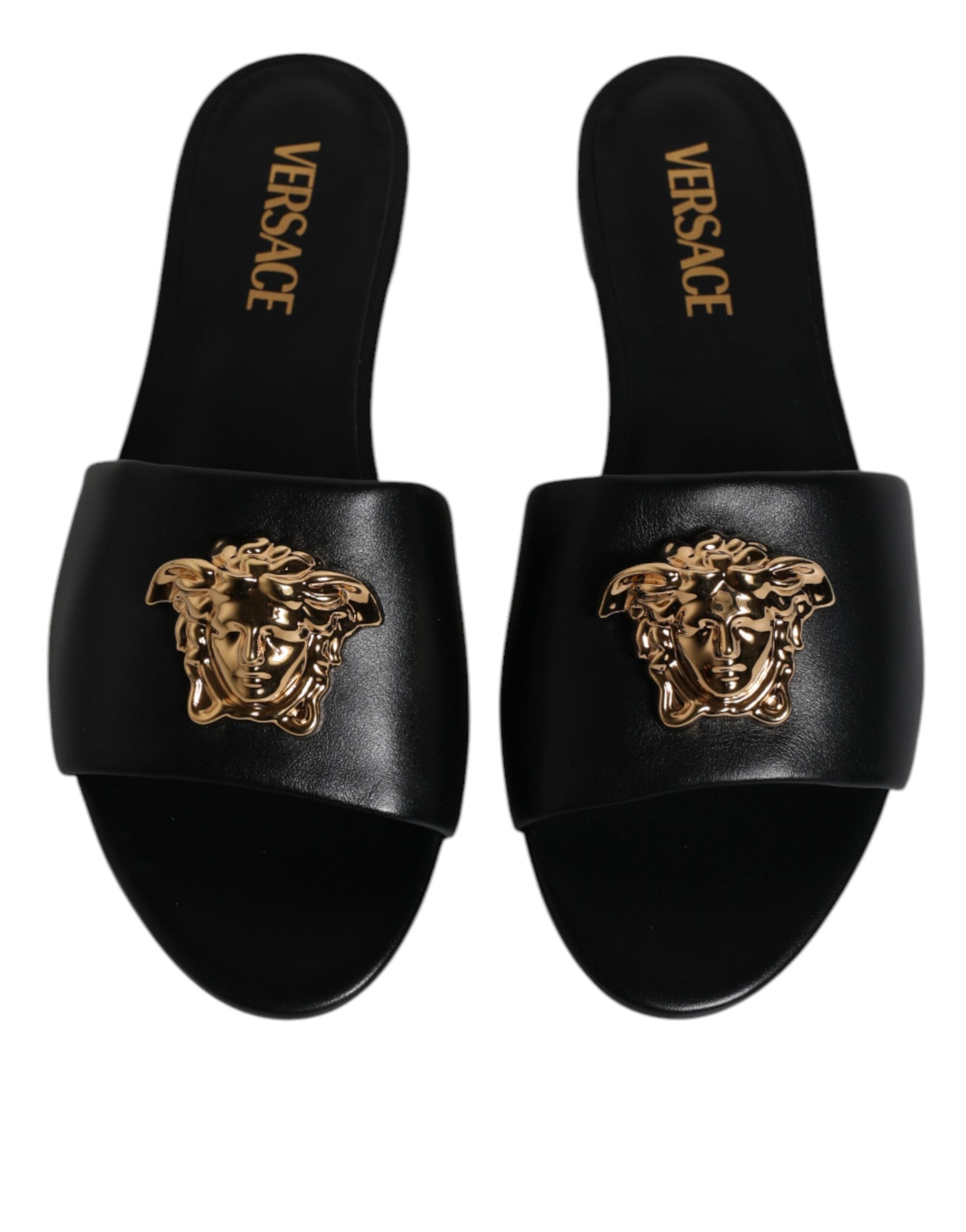 Sandales plates Versace en cuir noir avec plaque logo