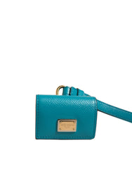 Étui AirPods Dolce &amp; Gabbana avec plaque logo verte, bracelet en cuir et métal doré