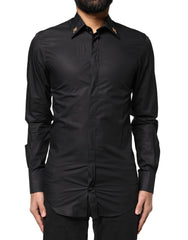 Chemise habillée Dolce &amp; Gabbana noire pour homme, ornée d'une croix dorée.