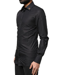 Chemise habillée Dolce &amp; Gabbana noire pour homme, ornée d'une croix dorée.