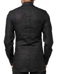 Chemise habillée Dolce &amp; Gabbana noire pour homme, ornée d'une croix dorée.