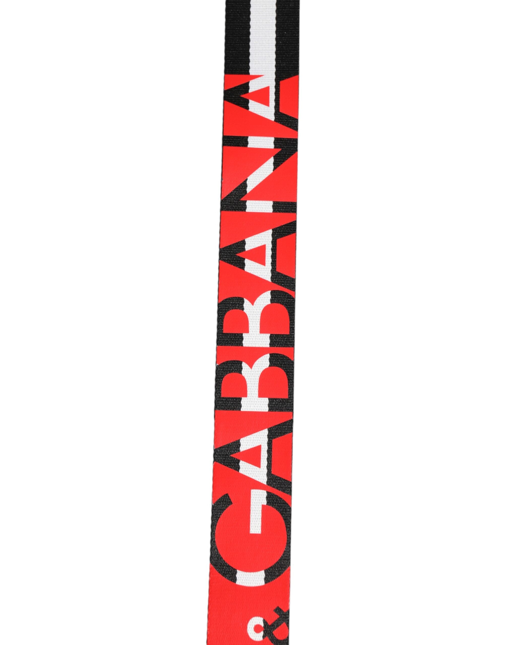 Dolce &amp; Gabbana Gürtel mit schwarz-weißen Streifen und Logo-Metallschnalle