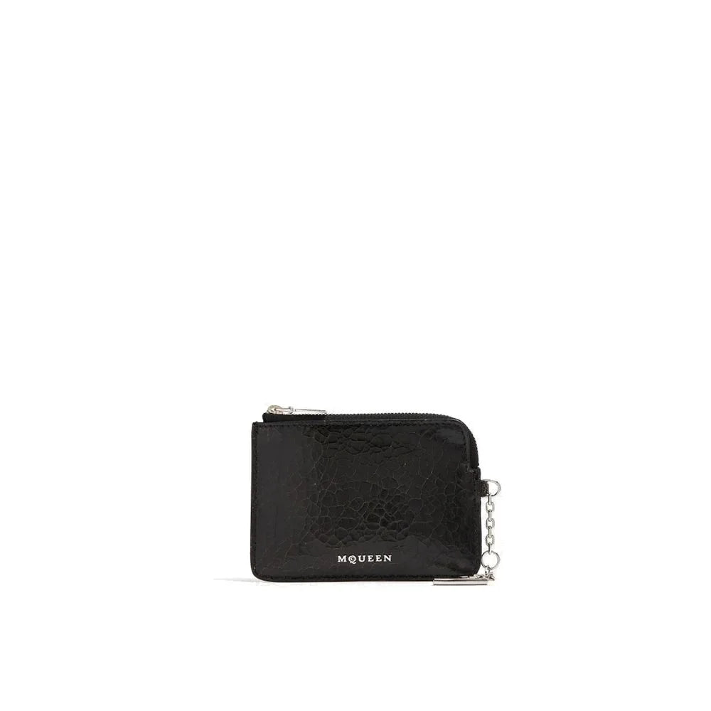 Front view of the Alexander McQueen black calfskin clutch bag featuring a minimalist rectangular silhouette.