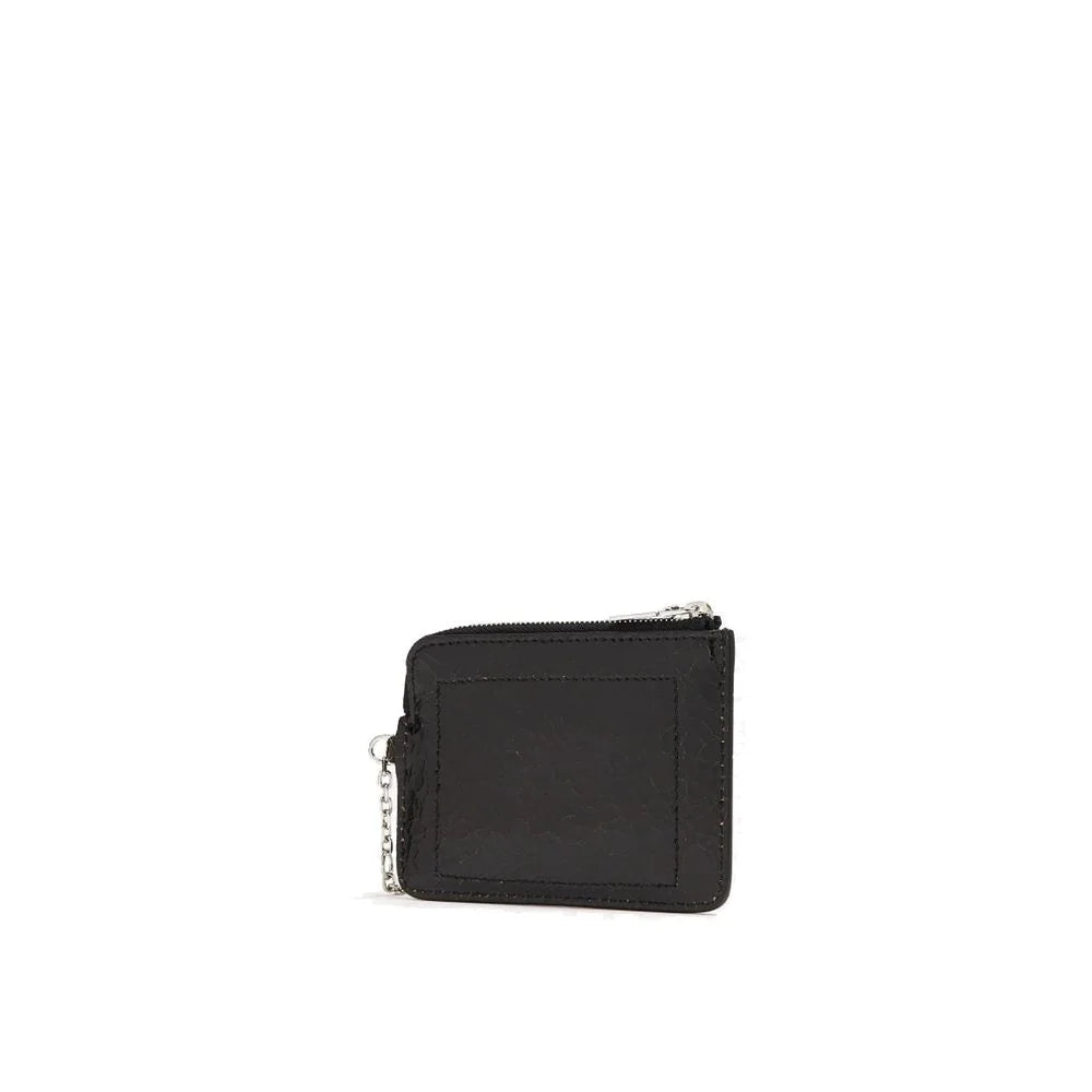Side profile of the Alexander McQueen leather clutch showing the slim construction and refined edge finishing.