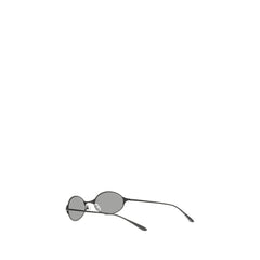 Angled view of Alexander McQueen luxury eyewear in gray metal, highlighting the refined bridge and tinted lenses.