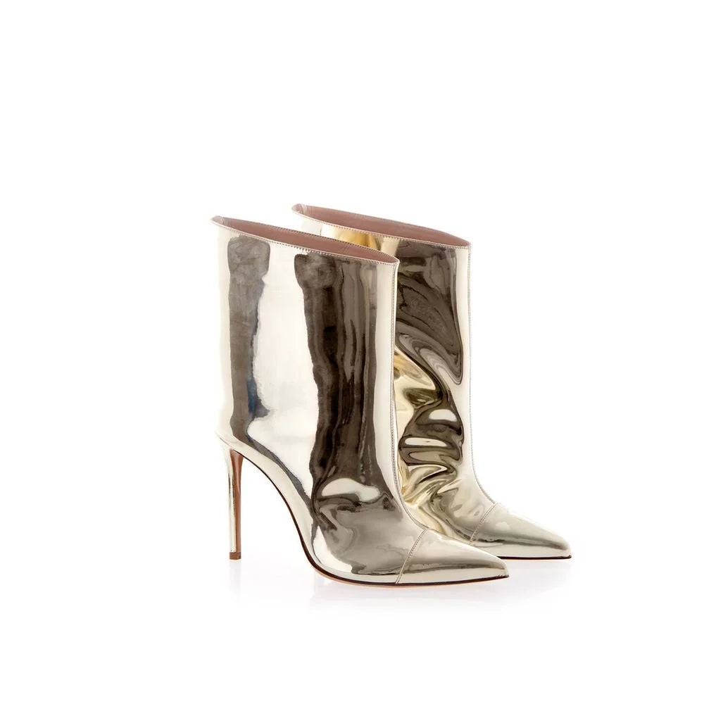 Side profile of Alexandre Vauthier patent leather boots showing the sleek stiletto heel and contoured silhouette.
