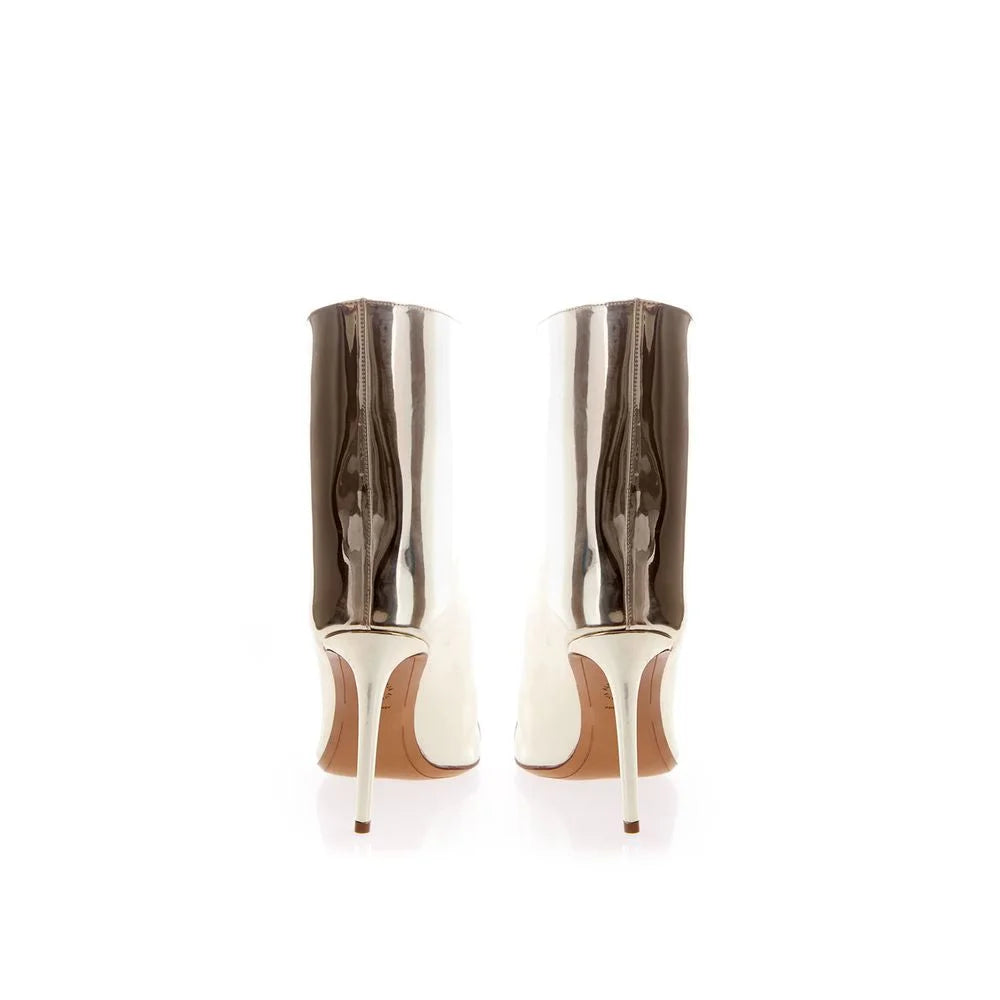 Close-up of the glossy patent leather texture and intricate multicolor print on these luxury Alexandre Vauthier boots.