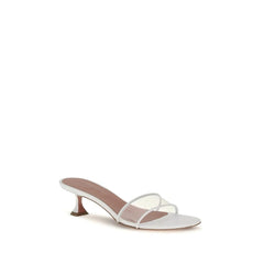 Side profile of Amina Muaddi white leather sandals showcasing the architectural flared heel and delicate ankle strap.