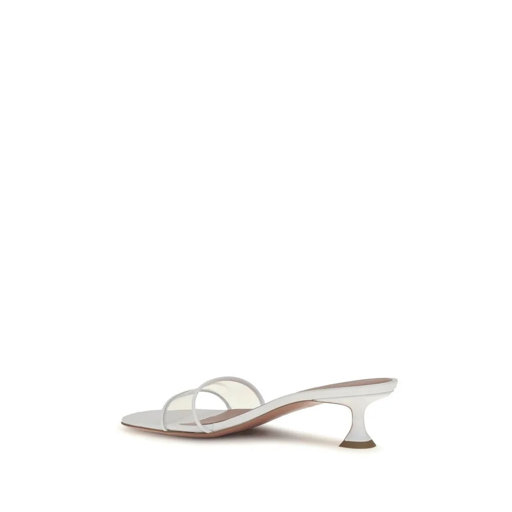 Rear view of the Bos Taurus sandal by Amina Muaddi in white leather, highlighting the geometric heel base and craftsmanship.