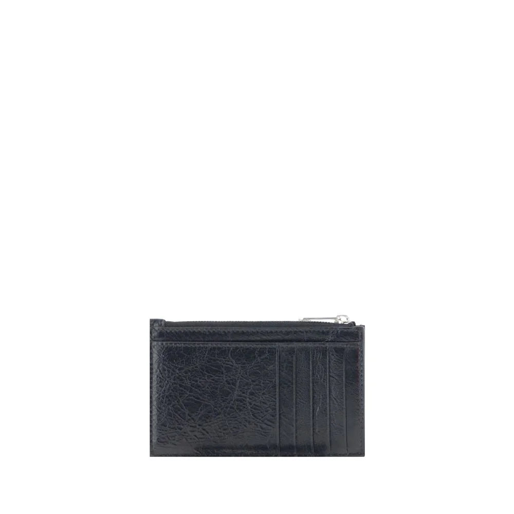 Interior view of the Balenciaga black leather wallet showing organized card slots and precise Italian craftsmanship.