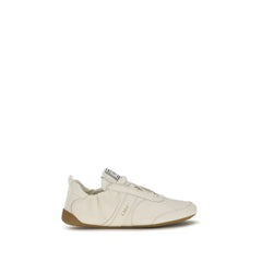 Chloé beige fabric athletic sneakers featuring a chunky sculpted sole and signature logo ribbon pull tabs.