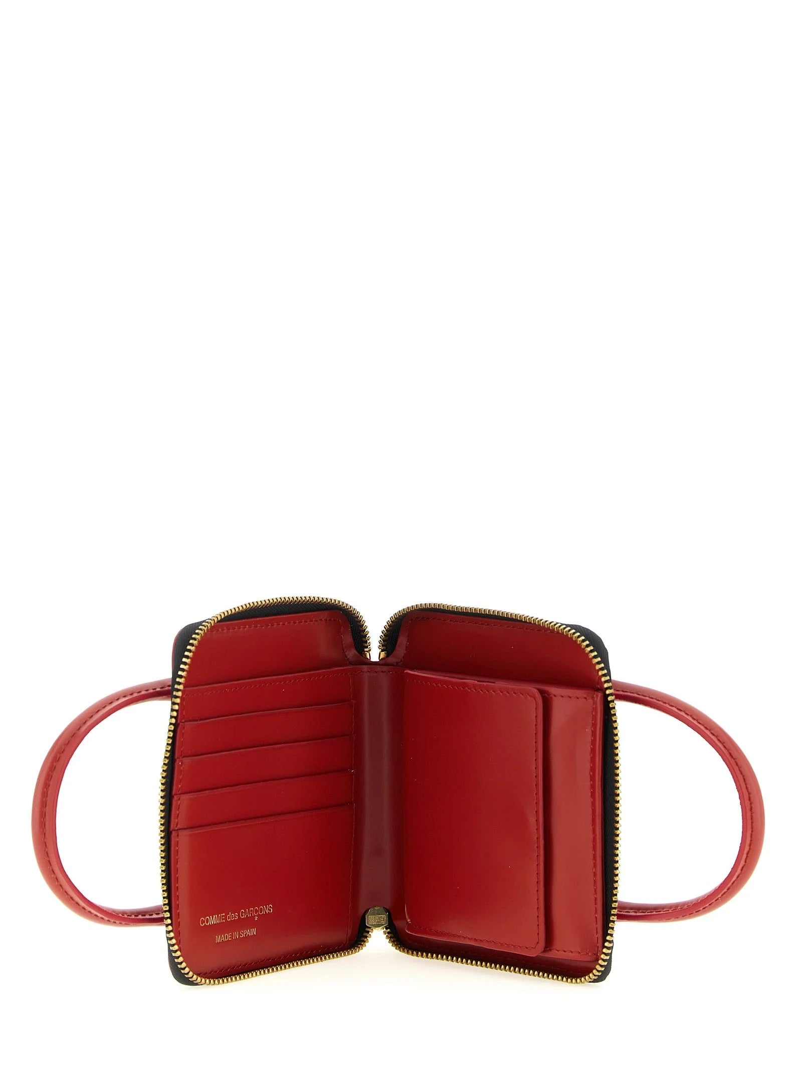 Gros plan du tampon intérieur du logo en doré sur le cuir de vachette premium de ce porte-cartes multicolore de créateur.