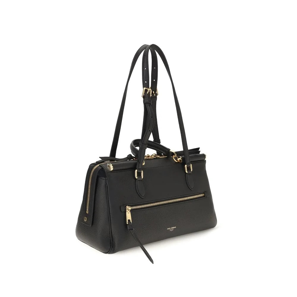 Rear view of the Dolce & Gabbana black leather shoulder bag highlighting the seamless craftsmanship and clean lines.