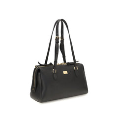 Side profile of the Dolce & Gabbana Bos Taurus bag in smooth black leather showing the slim, elegant proportions.