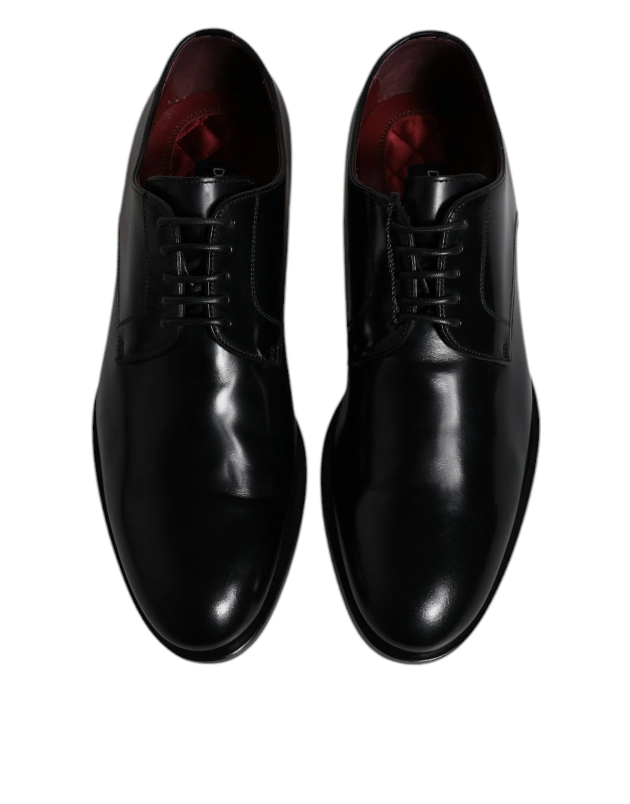 Sivukuva Dolce & Gabbana mustista nahkaisista Derby-kengistä, jotka esittelevät tyylikkään siluetin ja pinottu kantapään.