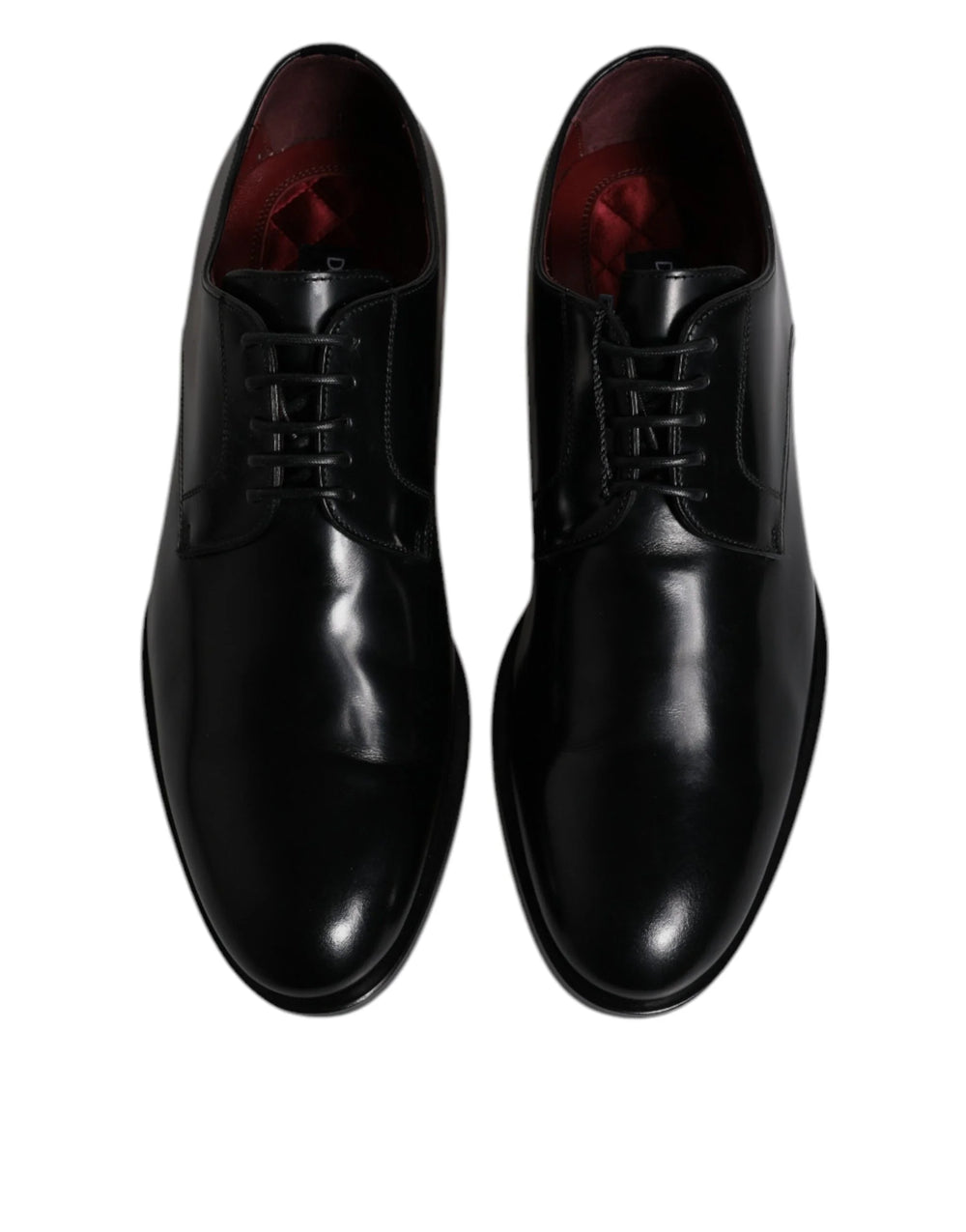 Sivukuva Dolce & Gabbana mustista nahkaisista Derby-kengistä, jotka esittelevät tyylikkään siluetin ja pinottu kantapään.
