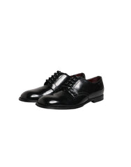 Top-down view of black leather Derby shoes by Dolce & Gabbana, showcasing the almond toe and open lacing system.
